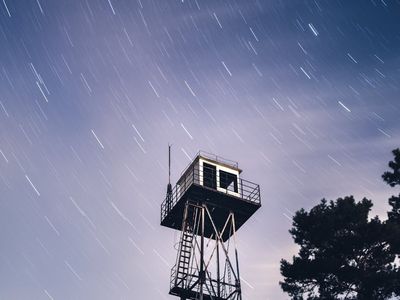 Silhouette of a person doing arm rotations